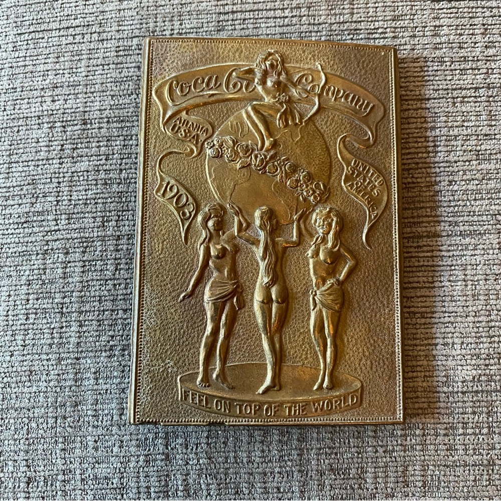 Coca Cola brass belt buckle, 3 semi nude women